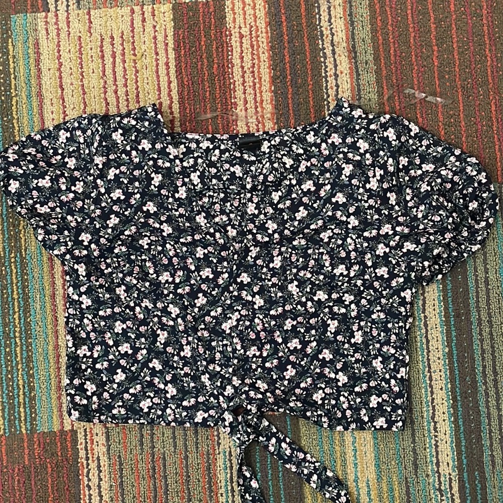 I got it from another store. Navy silk shirt with flowers on it. It’s a size S